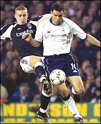 Sean Davis of Fulham tackles Tottenham's Gustavo Poyet