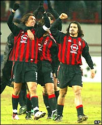 The AC Milan players celebrate winning in Moscow