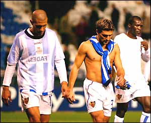 A disappointed Basle team leave the pitch in Spain after losing 1-0 to Deportivo La Coruna