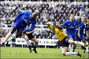 Jimmy Floyd Hasselbaink heads past the stranded Carlo Cudicini