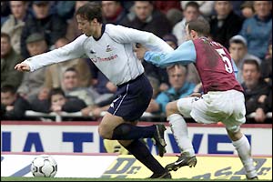 Tottenham's Maurizio Taricco tries to get away from Lee Bowyer