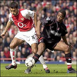 Arsenal's Giovanni Van Bronckhorst tackles Charlton's Kevin Lisbie 