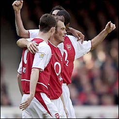 Arsenal players celebrate going two nil up
