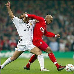 Mikael Silvestre of Manchester United battles with El Hadji Diouf