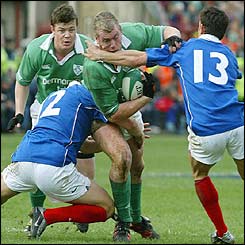 Irish flanker Victor Costello attempts to break through the French defence