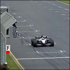 McLaren's David Coulthard takes the chequered flag to win the Australian Grand Prix