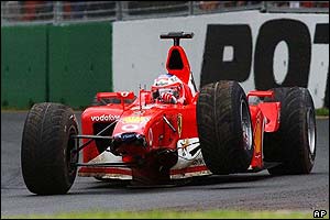 Ferrari driver Rubens Barrichello drives his crash-damaged car back towards the pits