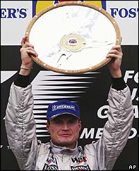 McLaren's David Coulthard holds the Australian Grand Prix shield aloft