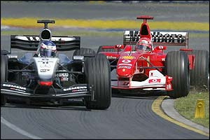 Ferrari's Michael Schumacher looks for a way past McLaren's Kimi Raikkonen