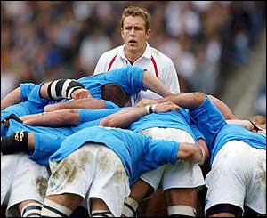 Jonny Wilkinson looks on as the two sets of forwards prepare for a scrum