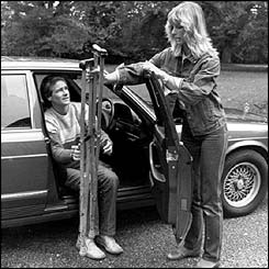 Motorcycle ace Barry Sheene is aided by his girlfriend Stephanie McLean as he recovers from a 175 mph crash that smashed both his legs