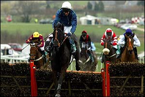 Back in Front with jockey Norman Williamson jumps the last to go on and win the Supreme Novices Hurdle