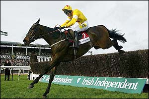 Azertyuiop with jockey Ruby Walsh jumps the last to go on and win the Irish Independent Arkle Trophy 