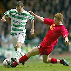 Celtic's Jamie Smith is tackled by John Arne Riise as the Hoops continue their pressure