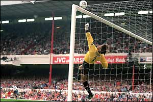 David Seaman parries away a shot during the North London derby