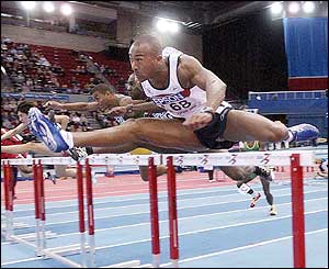 Colin Jackson qualifies for the final of the 60m hurdles in his last championship before retirement
