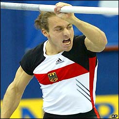 Germany's Tim Lobinger grimaces as he jumps to pole vault gold