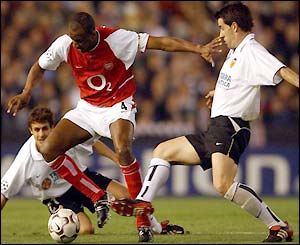 Arsenal captain Patrick Vieira uses his strength to hold off Albeda