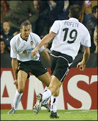 Carew celebrates his second goal for Valencia