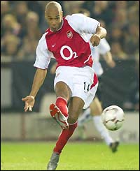 Thierry Henry curls a shot home to level for Arsenal after 49 minutes