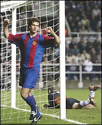 Thiago Motta punches the air joyously after scoring Barcelona's second, whilst Newcastle keeper Shay Given can only lie helpless on the ground