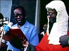 Yusufu Lule (left) being sworn into office