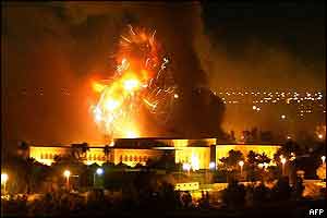 One of Saddam Hussein's presidential palaces explodes into flame as it is hit by bombs