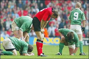 Players from both teams collapse after the game
