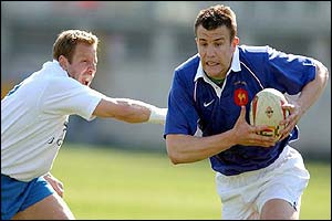 Damien Traille sprints clear of Paulo Vaccari to score another try for France