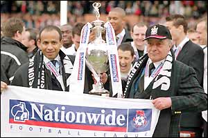 Jean Tigana and Mohammed Al Fayed celebrate with the Division One trophy