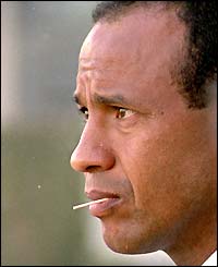 Jean Tigana sits chewing a toothpick