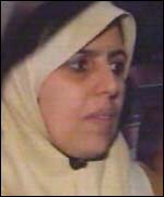 Iraqi woman and child in back of car