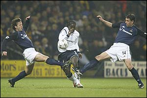 Spurs full-back Mauricio Taricco and midfielder Gus Poyet challenge Bolton wideman Bernard Mendy