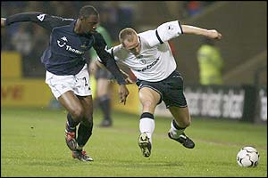 Spurs' Ledley King closes down Bolton's Henrik Pedersen