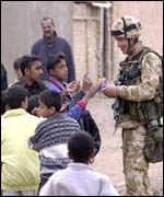 British Marine giving sweets to Iraqi children