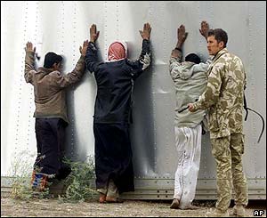 The soldiers are also trying to keep order - this time stopping alleged looters