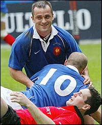 France Thomas Castaignede celebrates with fly-half Frederic Michalak 
