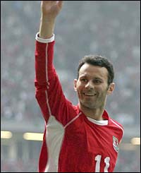 Ryan Giggs celebrates scoring Wales' fourth goal