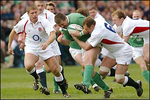Marcus Horan of Ireland is hauled down by Richard Hill
