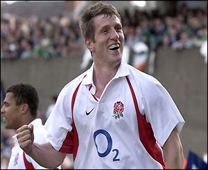 Will Greenwood smiles to the crowd after his second try