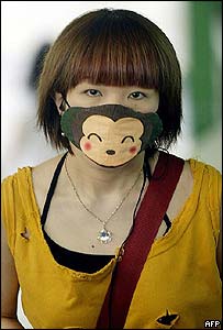 Woman wears a colourful mask to protect her from Severe Acute Respiratory Syndrome