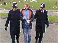 Picket flanked by two policemen