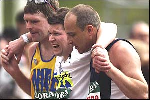 A runner is helped along