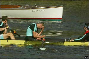 The Cambridge stroke Tim Wooge holds his head in his hands after the collision