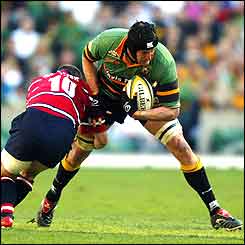 Northampton's Mark Connors (right) is challenged by Ludovic Mercier of Gloucester 