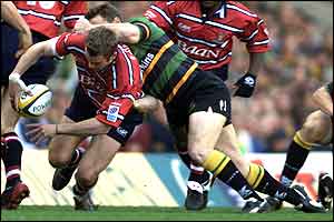 Gloucester's James Simpson-Daniel (left) is tackled by Northampton's Peter Jorgensen 