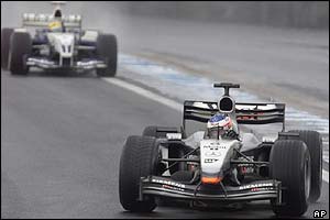 McLaren's Kimi Raikkonen leads the race on the 54th lap
