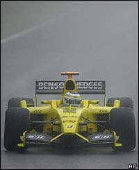 Jordan's Giancarlo Fisichella finishes in first place when the race is stopped after 55 laps