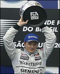 Finland's Kimi Raikkonen celebrates his victory in a dramatic Brazilian Grand Prix