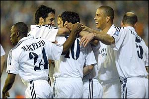 Real Madrid's players congratulate Luis Figo